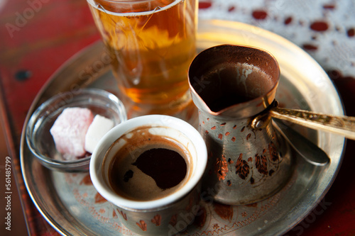 Traditional Bosnian Coffee served from a copper pot with local sweets. Sarajevo, Bosnia and Herzegovina photo