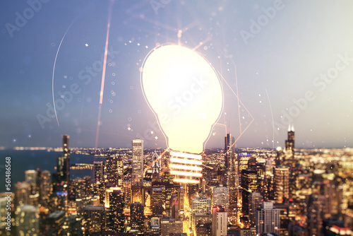 Abstract virtual light bulb illustration on Chicago cityscape background, future technology concept. Multiexposure