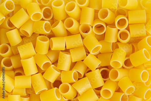 Italian pasta canneroni lisci background. Top view, close up.