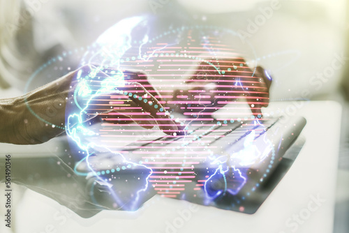Double exposure of abstract digital world map with connections and hand typing on computer keyboard on background, big data and blockchain concept