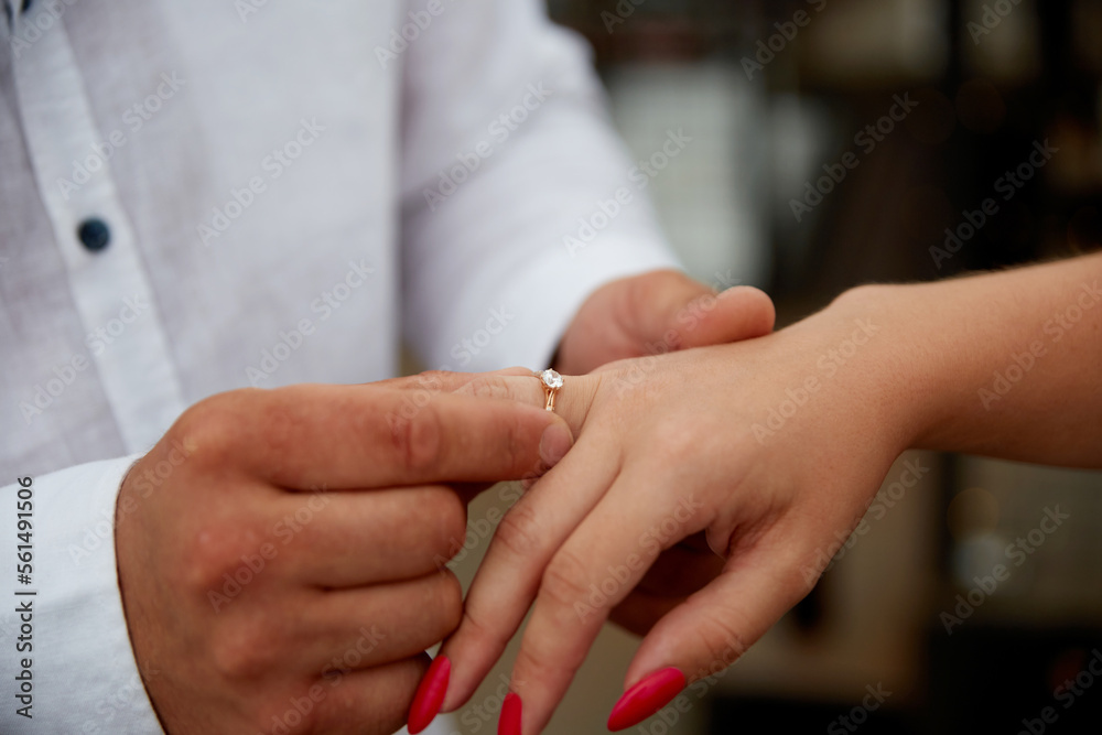 Young couple is getting engaged, man propose woman, new family celebration, engagement ring, jewellery