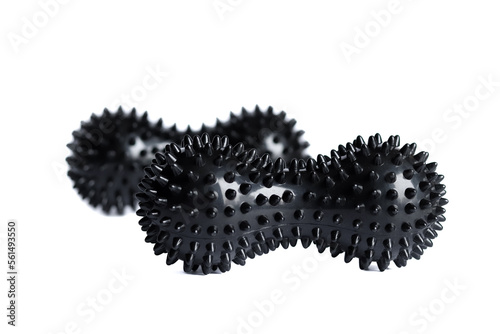 Black double or peanut spiky balls massager for yoga pilates or stretching and fascia pain. Sports equipment for fitness isolated on a white background. Concept of sports massage.