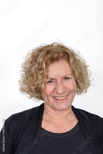 attractive laughing mature woman with curly hair