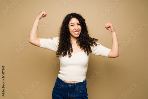 Powerful young woman feeling very strong