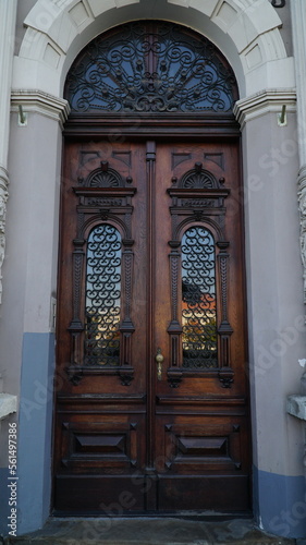 door. old wooden Front Door of a Traditional European Town House. Big Double Arch Door