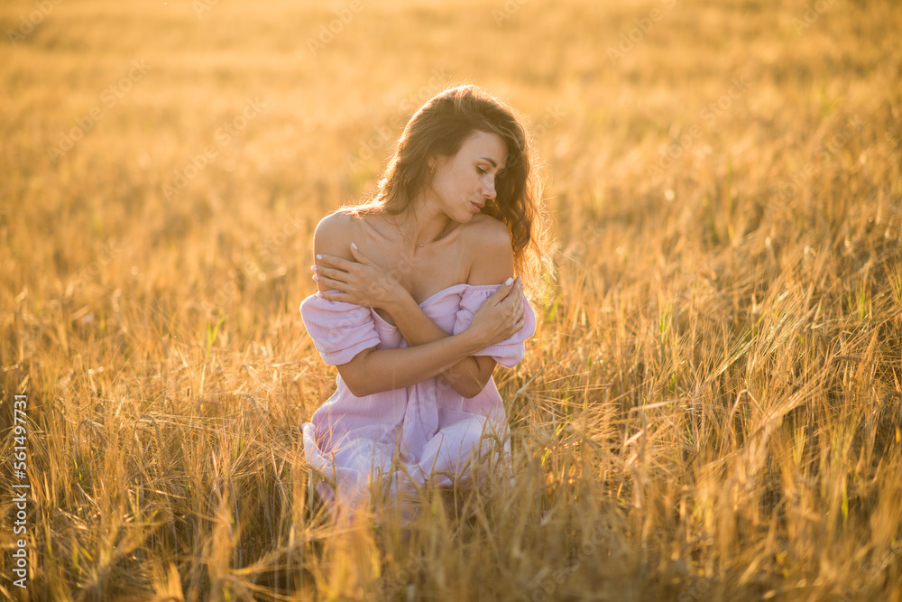 portrait of a happy young girl in a dress in a wheat field at sunset, the concept of peace and unity with nature portrait of a happy young girl in a dress in a wheat field at sunset, the concept of peace and unity with nature