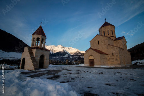 St. Nicholas Church in Mestia Georgia, with the Caucasus Mountains in the background. 