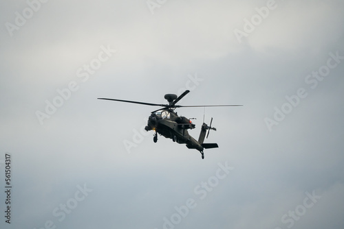 close-up of a British army AH-64E Boeing Apache Attack helicopter (ZM722 ArmyAir606) in flight on a military exercise, Wilts UK