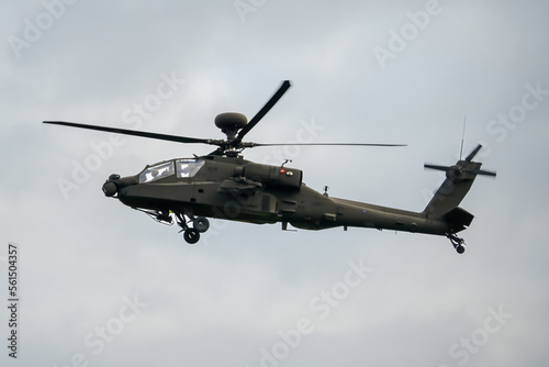 Wallpaper Mural a dark coloured helicopter flying low to the ground  Torontodigital.ca