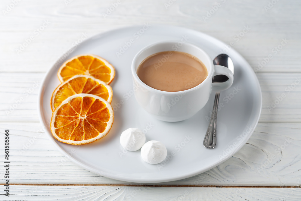 Coffee with cream, fluffy protein cake and dried oranges