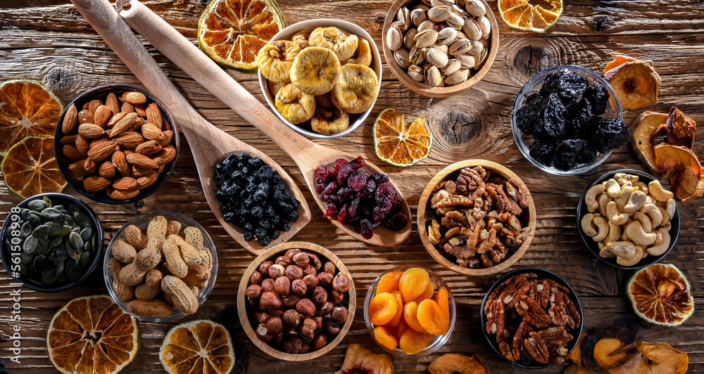 Composition with a variety of dried fruits and assorted nuts.