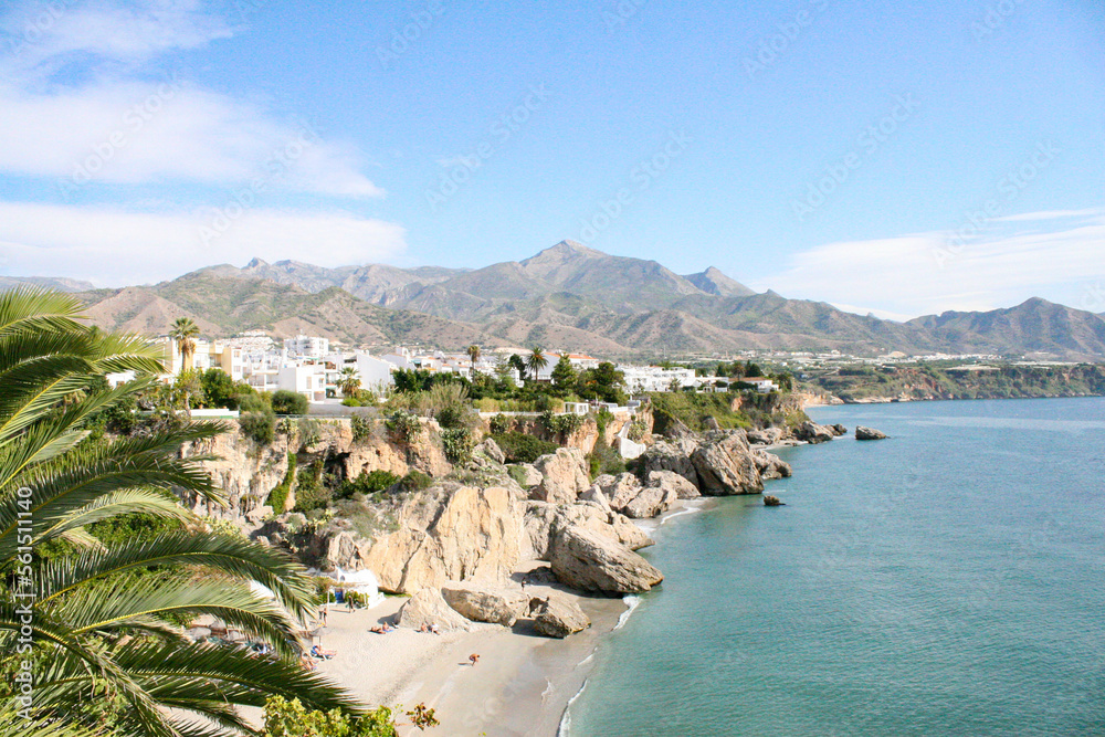 An aerial, panoramic view over the Mediterranean Sea and the beach town of Nerja on a sunny clear day.  Image has copy space.
