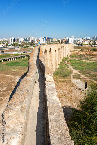 Old Kamares Aqueduct or Bekir Pasha Aqueduct near Larnaca, Cyprus. Scenic view of historical landmark and popular tourist attraction, distinctive arches in Roman style, outdoor travel background photo