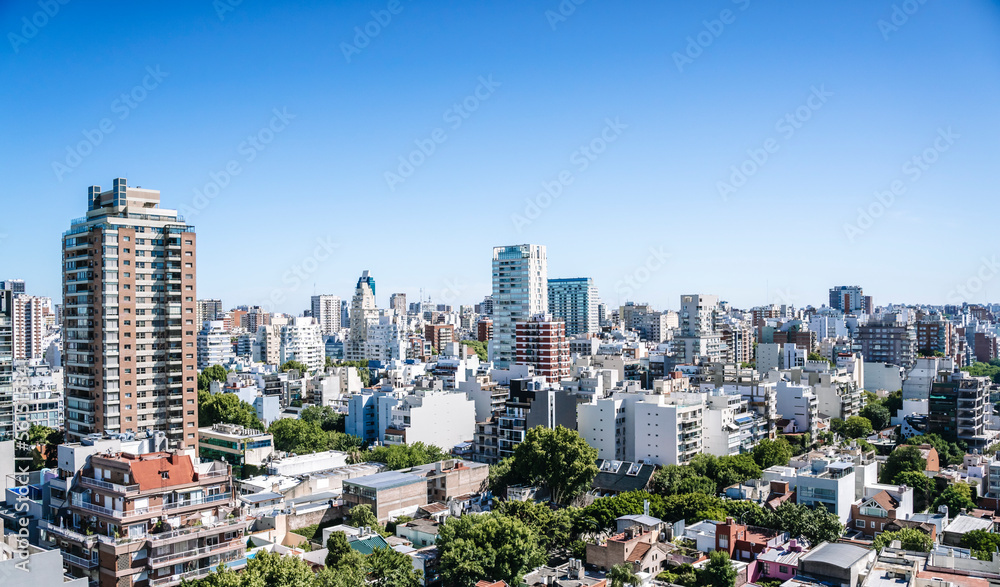 Fototapeta premium View of Buenos Aires from above. Cityscape architecture, houses and roofs of areas of Buenos Aires, Argentina.