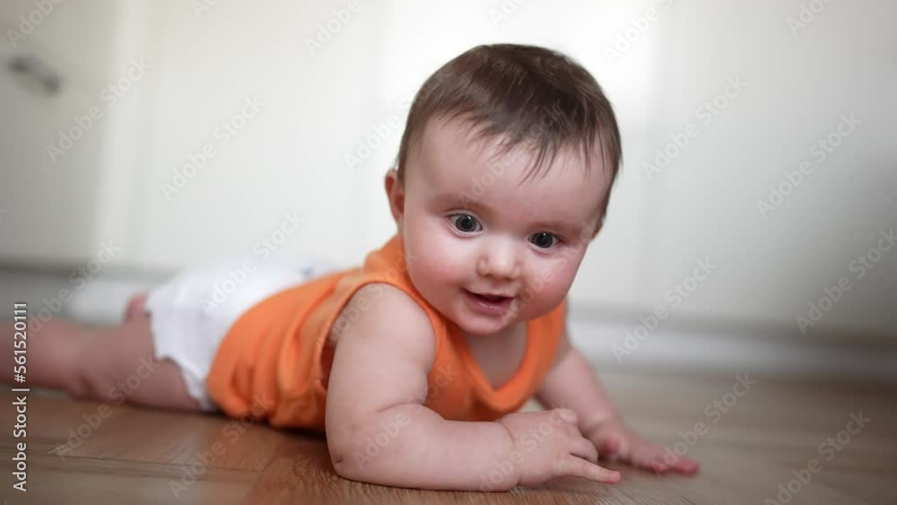 beautiful baby crawling. carefree childhood. baby a girl funny crawling on the pope on the floor learning to crawl. Portrait of colorful lifestyle baby crawling beautiful baby crawling. carefree childhood. baby a girl funny crawling on the pope on the floor learning to crawl. Portrait of colorful lifestyle baby crawling