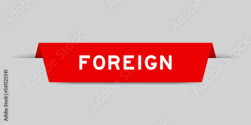 Red color inserted label with word foreign on gray background