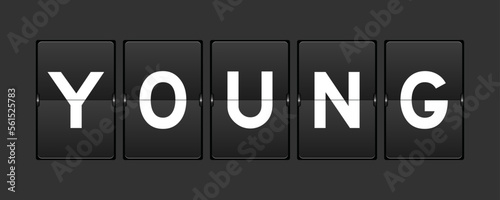 Black color analog flip board with word young on gray background