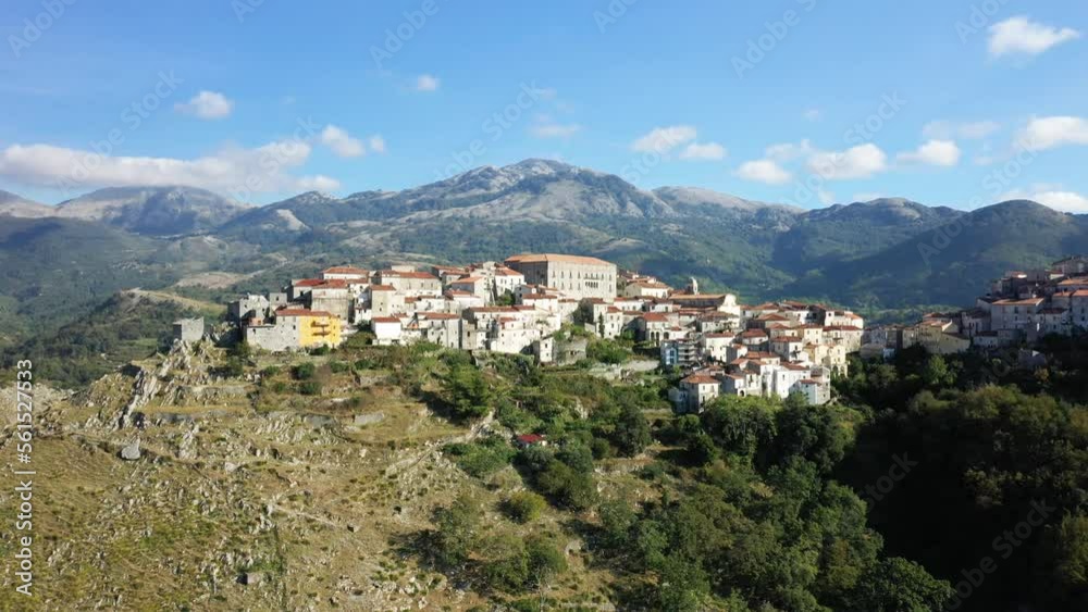 The village of Aieta in the middle of the green and arid countryside in Europe, Italy, Calabria, in summer on a sunny day. The village of Aieta in the middle of the green and arid countryside in Europe, Italy, Calabria, in summer on a sunny day.