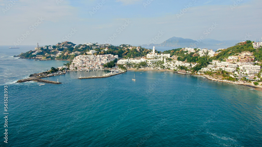 Aerial view of Peninsula de Santiago in city Manzanillo, Mexico. Beautiful bitch, luxury hotels and yachting bay.