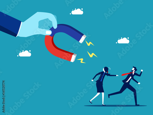 Fototapeta Businessman and woman fleeing from the gravitational pull of the magnet