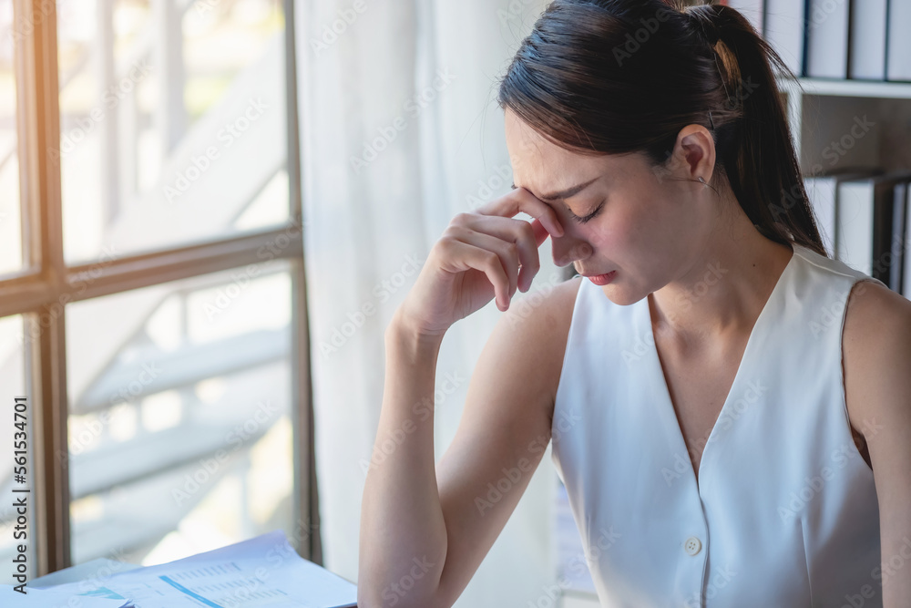 Concept Burnout Syndrome. Business Woman feels uncomfortable working. Which is caused by stress, accumulated from unsuccessful work And less resting body. Consult a specialist psychiatrist. Concept Burnout Syndrome. Business Woman feels uncomfortable working. Which is caused by stress, accumulated from unsuccessful work And less resting body. Consult a specialist psychiatrist.