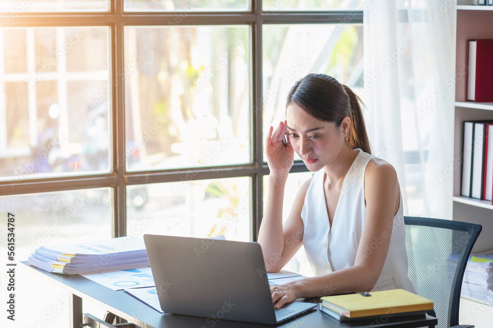 Marketing, Finance, Accounting, Planning, Team female accountant using laptop calculator and documents, charts, graphs in the analysis of the company is profit. Marketing, Finance, Accounting, Planning, Team female accountant using laptop calculator and documents, charts, graphs in the analysis of the company is profit.
