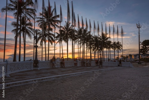 Praça das Bandeiras, Gonzaga beach. City of Santos, Brazil. Sunset on the beach.