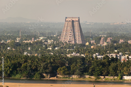 An aerial view of the tall gopuram tower of the Sri Ranganathaswamy temple and its green surroundings in the town of Srirangam from Trichy. photo