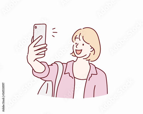 Happy woman beaming smile making selfie. Hand drawn style vector design illustrations.