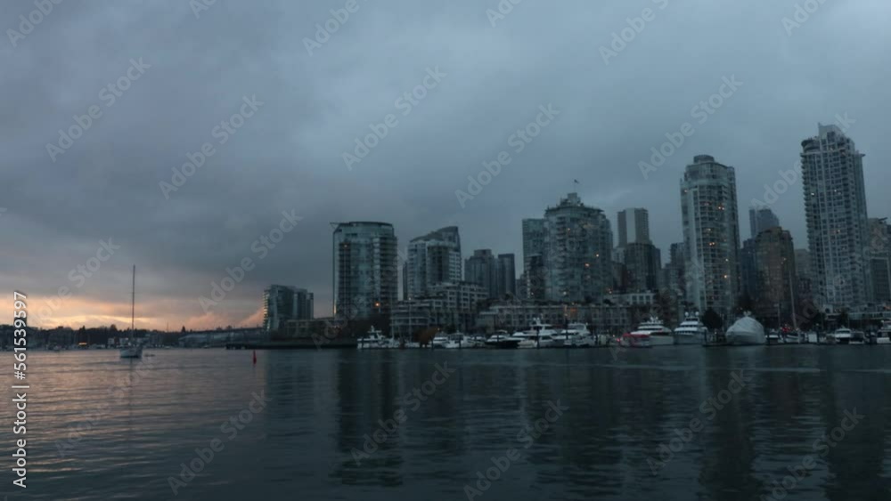 Boats with passengers 4K timelapse near Vancouver downtown on a cloudy evening Boats with passengers 4K timelapse near Vancouver downtown on a cloudy evening