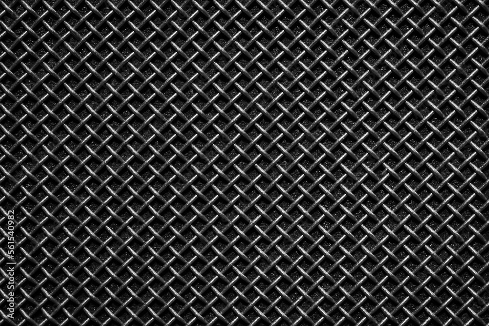 Black metal grill grid mesh texture. Close up. Metal with a rough texture.  Macro of the speaker grill. pattern for the background and 3d material.  close up. Stock Photo