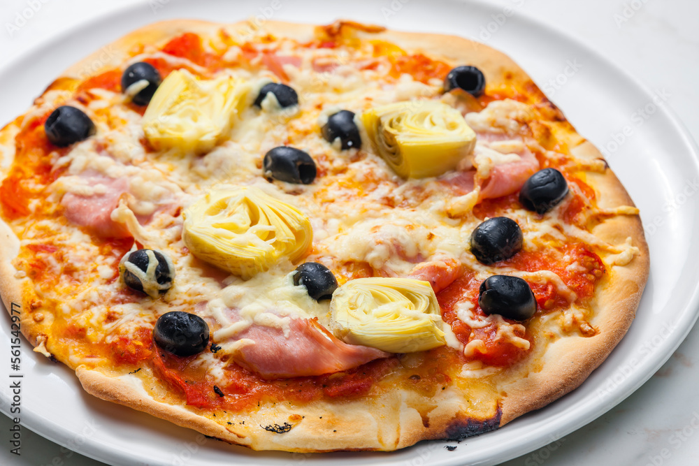 pizza with ham, black olives and artichokes pizza with ham, black olives and artichokes