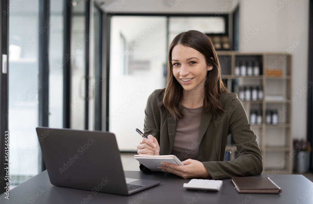 Beautiful woman at the modern office with a computer laptop. Beautiful woman at the modern office with a computer laptop.
