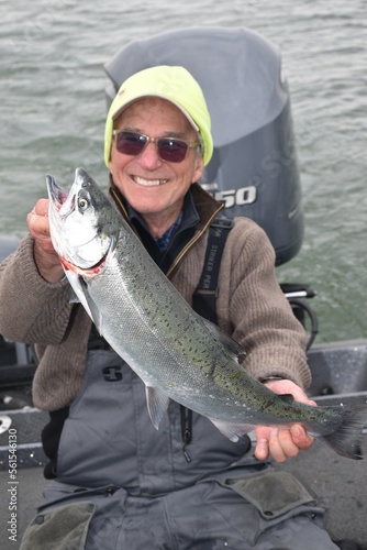 A smiling angler with a salmon 