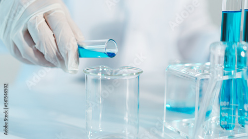 Scientist experimental in laboratory with test tube and beaker for medical research