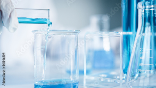 Scientist experimental in laboratory with test tube and beaker for medical research