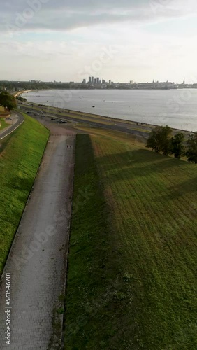 Vertical video: hyperlapse with city, sea and sunset views