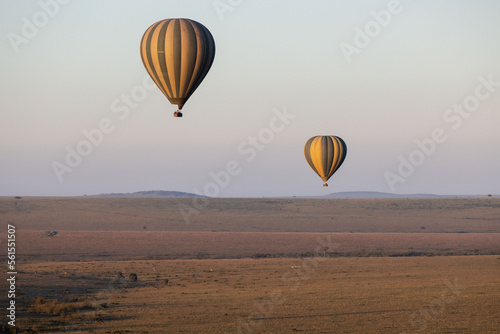 Hot air balloons floating over sunrise in Kenya's Masa Marai