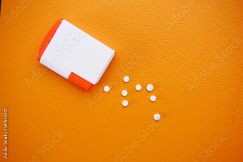 artificial sweetener container on orange background 