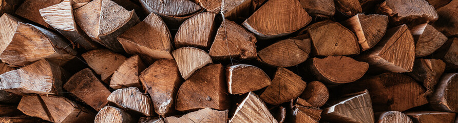 Fototapete Brennholz Textur Horizontal image Chopped firewood is stacked in a big pile  © Ok