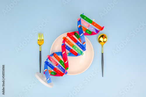 DNA helix structure, spoon, fork beside. Personalized food DNA and nutrition, checking allergic food, food intolerance, nutrition effect human life, DNA food and genetically modified foods