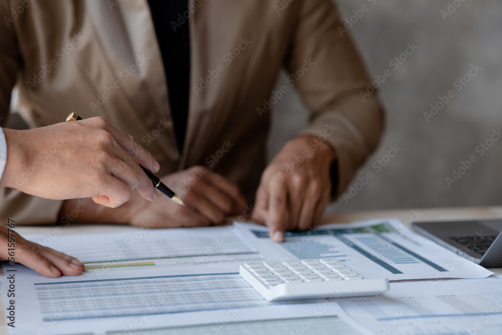 Fototapeta premium Atmosphere of a startup company meeting, business people are meeting together to summarize and plan investment finances, they are the founders of the company. Business administration concept.