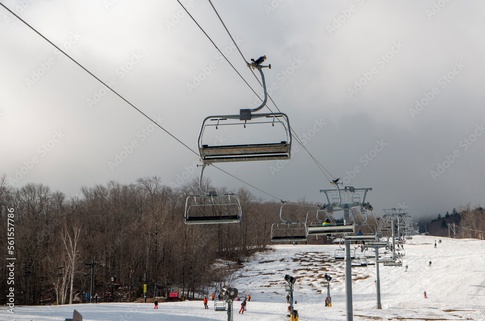 Empty chairlifts with snow melting at Mount Snow in Vermont Empty chairlifts with snow melting at Mount Snow in Vermont