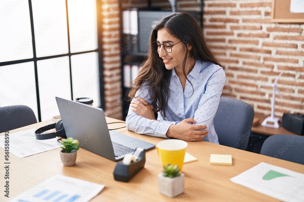 Young hispanic girl business worker using laptop working at office Young hispanic girl business worker using laptop working at office