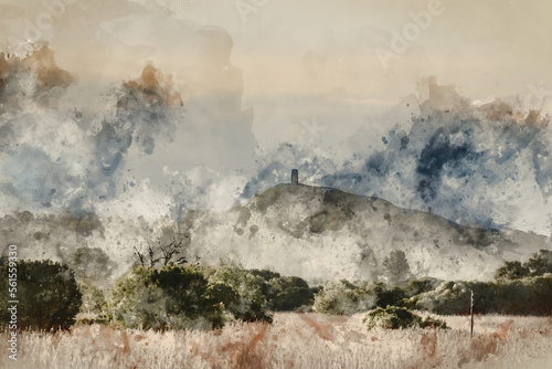 Digitally created watercolour painting of Beautiful landscape image of Glastonbury Tor in Somerset during Spring dawn over the Levels