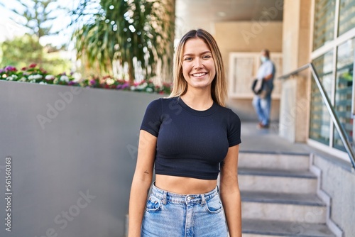 Young hispanic woman smiling confident standing at street © Krakenimages.com