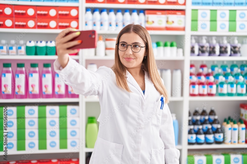 Young beautiful hispanic woman pharmacist smiling confident make selfie by smartphone at pharmacy Young beautiful hispanic woman pharmacist smiling confident make selfie by smartphone at pharmacy