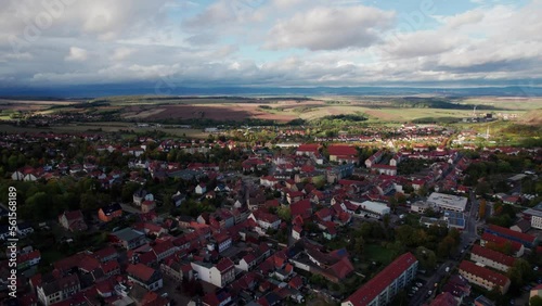 4k arielview flight over a little beautiful town with a church and a market. Germany. photo