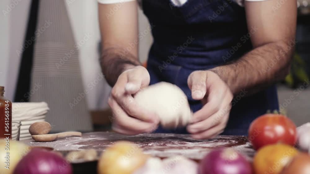 Cacuasian men preparing pizza dough homemade in small business Cacuasian men preparing pizza dough homemade in small business