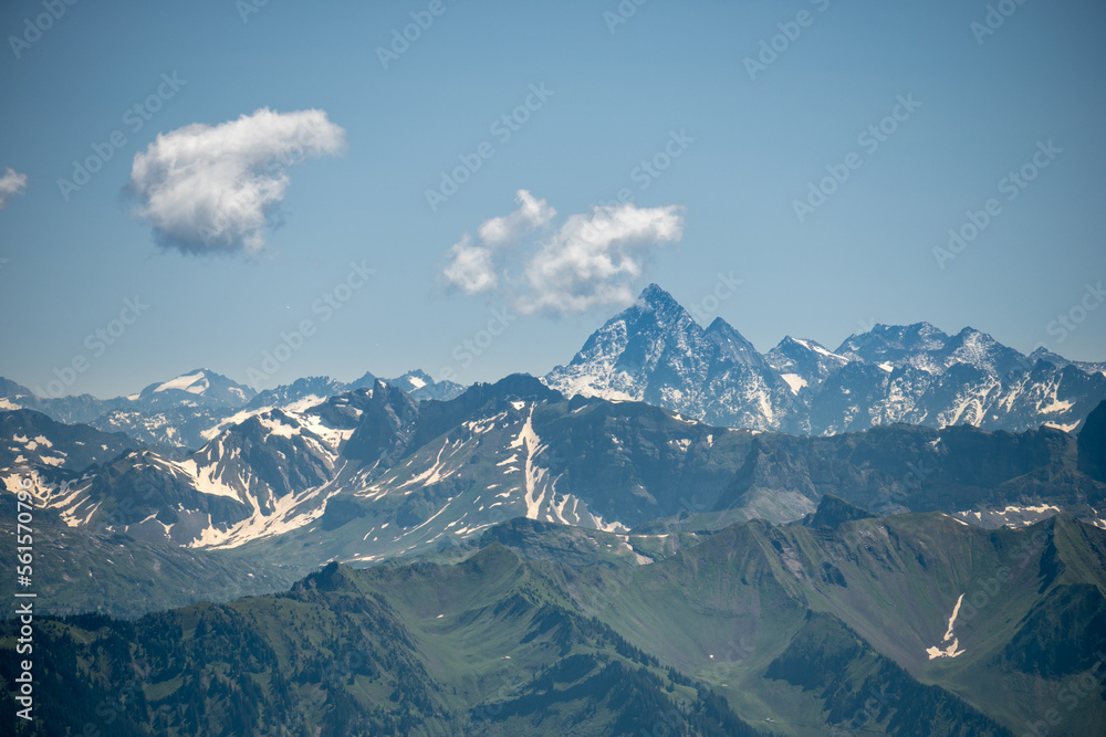 Many mountain peaks of the swiss alps in the distance